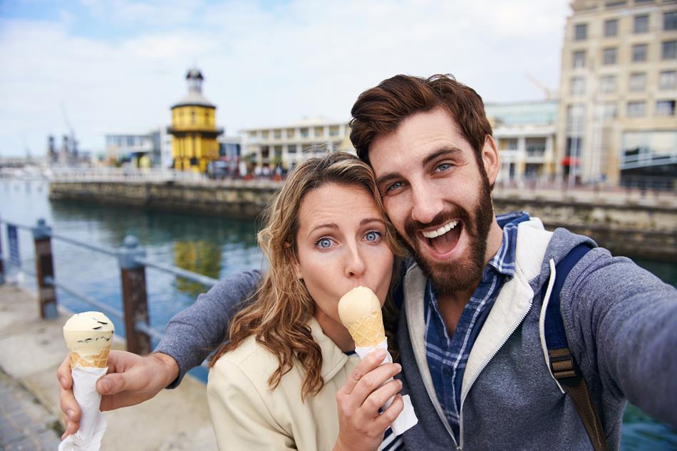 couple eating icecream taking selfie on holiday vacation travel